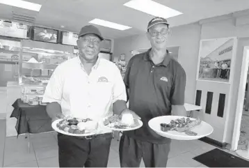  ??  ?? Harry Sinclair and Christophe­r Alexander, owners of Butter Flakes Bakery & Grill in Tamarac on April 12.
CARLINE JEAN/SUN SENTINEL