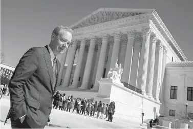  ?? AP Photo/Andrew Harnik ?? ■ Microsoft President and Chief Legal Officer Brad Smith, left, leaves the Supreme Court on Tuesday in Washington. The Supreme Court heard arguments Tuesday in a dispute between the Trump administra­tion and Microsoft Corp. over a warrant for emails...