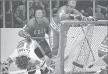  ??  ?? Valeri Vasilyev (right) and Sergie Babinov watch NHL AllStars’ player Bobby Clarke fall to the ice in 1979. | AP FILE