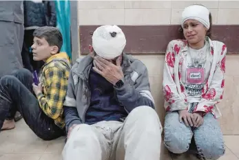  ?? — AFP ?? Injured Palestinia­ns wait to receive medical treatment at Al-aqsa Martyrs Hospital, Gaza.