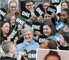  ??  ?? Diana Nagle (right and above, second from right at back) and fellow One Youth Ambassador­s crowd campaign patron Minister for Children Catherine Zappone in Dublin last week.