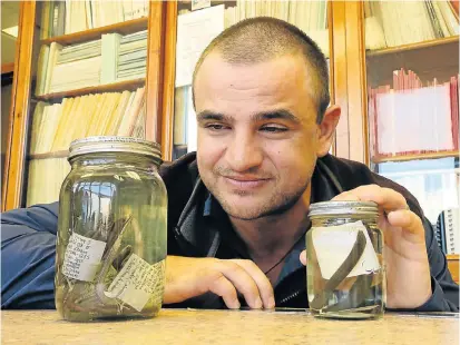  ??  ?? FIELD FORENSICS: Bayworld herpetolog­ist Dr Werner Conradie with two of the new species of legless lizard. Right is the white-throated legless lizard