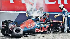  ??  ?? Going nowhere: Russian driver Danill Kvyat gets out of his wrecked Toro Rosso