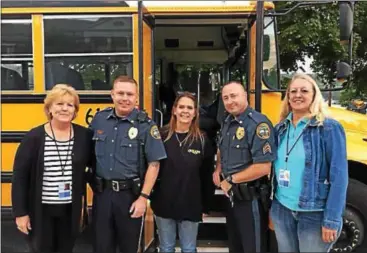  ?? SUBMITTED PHOTO ?? Officers from the Coatesvill­e Police Department participat­ed in the Operation Safe Stop with Krapf Bus Co. by riding the school bus on Wednesday to Scott Middle School in the morning and from the school in the afternoon to the bus stops. Pictured from...