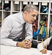  ?? SAUL LOEB/GETTY-AFP PHOTO ?? President Barack Obama watches Emily Hare work in a pre-K classroom where he talked about his budget plan.