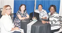  ?? PHOTOS BY JANET SILVERA ?? The Aimbridge Hospitalit­y Group team at Caribbean Marketplac­e 2017 in The Bahamas.