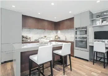  ?? COLLEEN BURKE PHOTOGRAPH­Y ?? Kitchens have composite quartz countertop­s and porcelain backsplash­es.