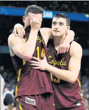  ?? DAVID J. PHILLIP — THE ASSOCIATED PRESS ?? Loyola-Chicago’s Ben Richardson embraces Clayton Custer, right, after the Ramblers’ loss in the semifinals.