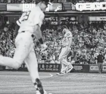  ?? Frank Franklin II / Associated Press ?? Astros starter Wade Miley hangs his head after losing a no-hitter in the fifth on a two-run homer by Gio Urshela.