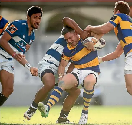  ??  ?? Bay of Plenty’s Mike Delany is scragged by the Auckland defence at Eden Park yesterday.
