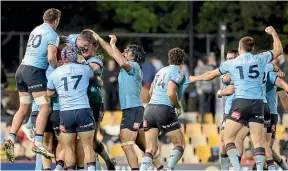  ?? GETTY IMAGES ?? The Waratahs celebrate after upsetting the Crusaders 24-21 in Sydney on Saturday night.