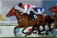  ?? Photo By Nezar Balout ?? Mahbooba, ridden by Richard Mullen, powers to victory at the Abu Dhabi Equestrian Club. —