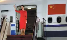  ?? JIN LIWANG / XINHUA ?? Meng Wanzhou, Huawei’s chief financial officer, greets people after her arrival at Shenzhen Bao’an Internatio­nal Airport in Guangdong province on Saturday.