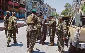 ?? EPA PIC ?? Soldiers arresting a suspected militant after an attack on the state-run RTA TV station in Jalalabad, Afghanista­n, yesterday.