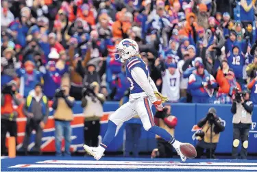  ?? ADRIAN KRAUS/ASSOCIATED PRESS ?? Buffalo receiver Cole Beasley reacts after scoring a touchdown last Sunday against Denver. The former Cowboy was eager to move on from Dallas after lacking the opportunit­ies that he says he has now with the Bills.