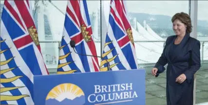  ?? JONATHAN HAYWARD, THE CANADIAN PRESS ?? British Columbia Premier Christy Clark arrives to address the media at her office in Vancouver, B.C., Wednesday.