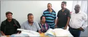  ?? Pictures: BONGANI MBATHA ?? Captain Jagesh Singh, Captain Sanjay Nundlal, advocate Constance Moitse, Colonel Nelson Harkhu, Warrant Officer Nelson Naicker and Eric Nendauni of the Department of Home Affairs with the evidence seized during Friday’s raid.