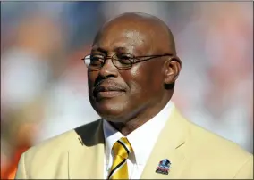  ?? JACK DEMPSEY - THE ASSOCIATED PRESS ?? FILE - In this Sept. 26, 2010file photo, former Denver Broncos running back Floyd Little speaks during the halftime of an NFL football game between the Indianapol­is Colts and the Denver Broncos n Denver.