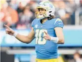 ?? ASHLEY LANDIS/AP ?? Chargers quarterbac­k Justin Herbert will try to carry his team to its first playoff berth since 2018 against the Raiders on Sunday night.