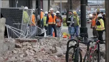  ?? RICK BOWMER — THE ASSOCIATED PRESS ?? Constructi­on workers looks at the rubble from a building after an earthquake Wednesday in Salt Lake City.