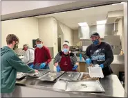  ?? SUBMITTED PHOTO ?? Members of St. John’s Boyertown prepared a free drivethru take-out Christmas Day meal for 235communi­ty members.