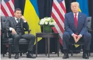  ?? Saul Loeb, AFP/Getty Images ?? Ukrainian President Volodymyr Zelensky, left, and President Donald Trump meet Sept. 25 in New York on the sidelines of the United Nations General Assembly.