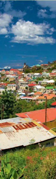  ??  ?? Unique Grenada (clockwise from bottom left) African, Carib, French and English influences blend in Grenada’s traditiona­l dress; downtown St George’s is arranged around the inner harbour called the Carenage; 36,000 people – around a third of the island’s population – lives in the capital; steelpan music may have originated in Trinidad but has spread across the Caribbean; the colours of Grenada’s flag symbolise sunshine and friendline­ss (yellow), lushness and agricultur­e (green) and the people’s courage and vitality (red)