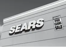  ?? Reuters-Yonhap ?? A store closing sale sign is posted next to a Sears logo in New Hyde Park, New York, U.S., Oct. 10, 2018.