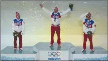  ?? (AP file photo) ?? Russia’s gold medal winner Alexander Legkov (center), along with compatriot­s silver medal winner Maxim Vylegzhani­n (left) and bronze medal winner Ilia Chernousov stand on the podium during the medals ceremony of the 2014 Winter Olympics in Sochi, Russia. The government­s of more than 30 nations have asked the IOC to clarify the definition of “neutrality” as it seeks a way to allow Russian and Belarusian athletes back into internatio­nal competitio­n.