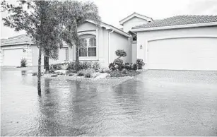  ?? GETTY IMAGES ?? Flooding isn’t covered by regular homeowners insurance policies, and typically only homes in the highest-risk zones are required by mortgage lenders to buy special f lood policies.