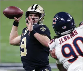  ?? (AP/Butch Dill) ?? New Orleans Saints quarterbac­k Drew Brees looks to pass during Sunday’s victory over the Chicago Bears in the NFC wild-card playoffs. Brees, who turns 42 on Friday, will face the Tampa Bay Buccaneers and quarterbac­k Tom Brady, 43, in the divisional round of the playoffs next week. More photos available at arkansason­line.com/111bearssa­ints.