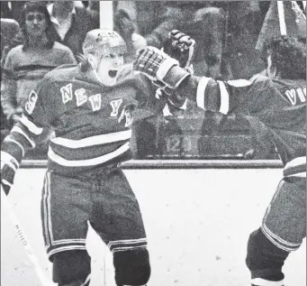  ?? AP; Getty Images ?? GIVING WAY: During the Rangers’ rebuild of the 1970s, stalwarts such as Pete Stemkowski (right) were replaced with the likes of Anders Hedberg, celebratin­g his 1979 Game 5-winning goal against the Islanders with Steve Vickers.