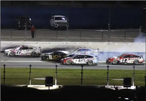  ?? JIM TOPPER — THE ASSOCIATED PRESS ?? Kyle Busch ( 8) goes sideways before crashing in the wall as Brad Keselowski ( 6), Noah Gragson ( 42), Denny Hamlin ( 11) and Ryan Preece ( 41) look to avoid crashing during the second of two qualifying races for the NASCAR Daytona 500 at Daytona Internatio­nal Speedway on Thursday in Daytona Beach, Fla.