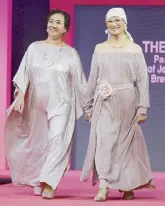  ??  ?? Breast cancer survivors Theresa Gan and Leilani Eusebio both wearing Mia Arcenas.