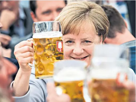  ??  ?? The German chancellor, campaignin­g at an event in a Bavarian beer tent, suggested that the election of Donald Trump and Brexit vote meant Europe must ‘fight for its own future’