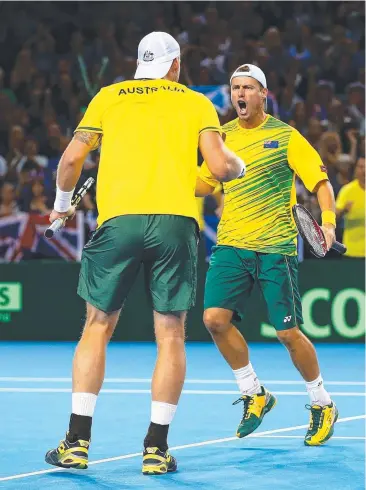  ?? Picture: GETTY IMAGES ?? PUMPED UP: Sam Groth and Lleyton Hewitt celebrate a point against Great Britain.