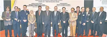  ??  ?? Fadillah (eighth right) together with Awang Tengah (sixth left), Wong (seventh right), Nancy (fourth left) and Yeoh (fifth left) pose for a group photo with the summit’s panellists. — Photo by Tan Song Wei