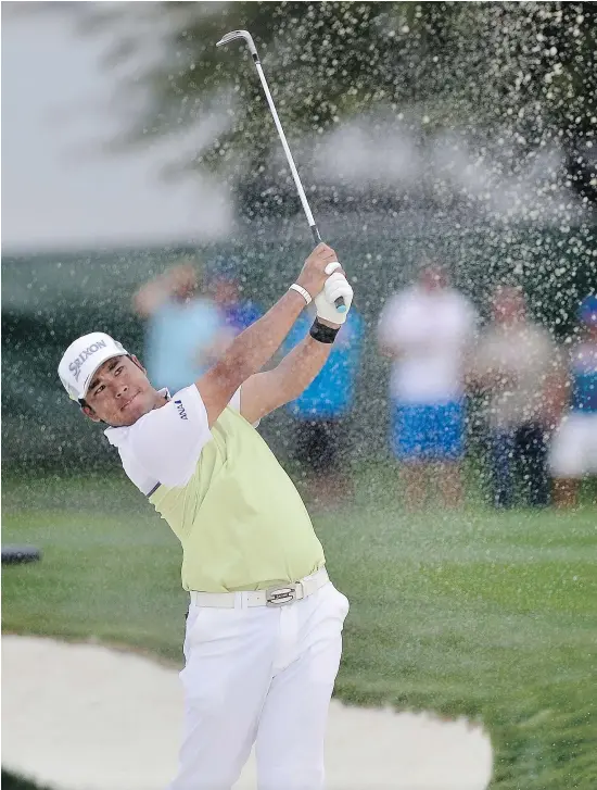  ?? — GETTY IMAGES FILES ?? Hideki Matsuyama plays his second shot on the third playoff hole during the final round of the Waste Management Phoenix Open at TPC Scottsdale on Sunday. He became the sixth player to successful­ly defend a title at the event.