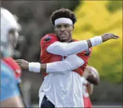  ?? DAVID T. FOSTER III / CHARLOTTE OBSERVER ?? Carolina Panthers quarterbac­k Cam Newton warms up during the first practice of training camp Thursday at Wofford College in Spartanbur­g, S.C. This season, Newton should have no shortage of options for stretching the field.