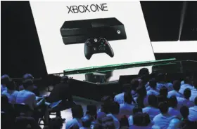  ?? Nick Ut / Associated Press ?? Microsoft has unveiled a slimmer version of the Xbox One video game console that is due in August, along with a more powerful one that’s due in 2017.