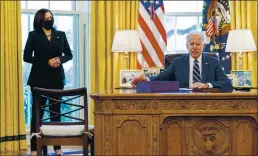  ?? ANDREW HARNIK — THE ASSOCIATED PRESS ?? President Joe Biden, accompanie­d by Vice President Kamala Harris, signs the American Rescue Plan, a coronaviru­s relief package, in the White House on Thursday.