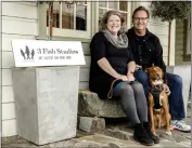  ?? ERIC REWITZER VIA AP ?? Husband and wife artist team Annie Galvin, left, and Eric Rewitzer pose with their dog Woody in front of their new 3 Fish Studios art gallery in Amador City. Galvin and Rewitzer moved out of San Francisco to live closer to nature after their sabbatical in France and Ireland.