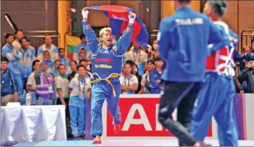  ?? SUPPLIED ?? Well-known Vovinam exponent Eh Virak Kham Chhit Phuthong celebrates as he clinches a gold medal at the 32nd SEA Games, held in Phnom Penh in May 2023.