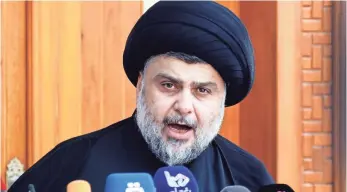  ?? HAIDAR HAMDANI, AFP/GETTY IMAGES ?? Muqtada al-Sadr is trying to position himself as a good-government advocate, analysts say.
