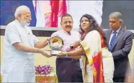  ?? PTI ?? Prime Minister Narendra Modi gives away an award during the Civil Services Day, 2017, function in New Delhi on Friday. Union minister Jitendra Singh (second from left) attended the event.