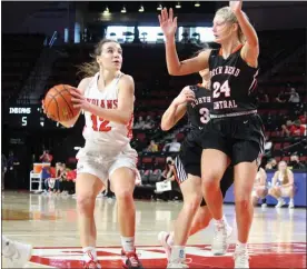  ?? Alex Eller ?? Kali Staples of Broken Bow looks to put a shot up over North Bend in the first round of the Class C1 State Tournament on March 3 at Pinnacle Bank Arena. She had five points in the game and ended the season as the team’s leader in assists.