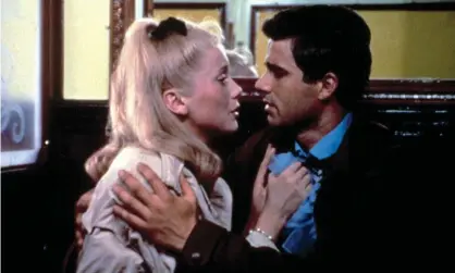  ?? Photograph: Everett/Alamy ?? Impossibly beautiful … Catherine Deneuve and Nino Castelnuov­o in The Umbrellas of Cherbourg.