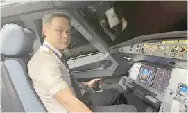  ?? PHOTOGRAPH COURTESY OF PAL ?? CAPTAIN Stan Ng makes history as the first PAL president to serve as pilot in command of a presidenti­al flight.