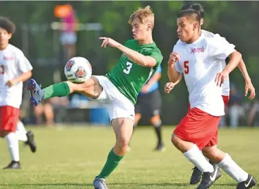  ?? STAFF PHOTO BY MATT HAMILTON ?? Sequoyah’s Victor Gutierrez (5) defends as East Hamilton’s Maddux Seal scores the first goal of the match at East Hamilton on Wednesday.