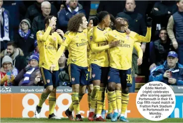  ??  ?? Arsenal’s Eddie Nketiah (right) celebrates after scoring against Portsmouth in their FA Cup fifth round match at Fratton Park Stadium in Portsmouth on Monday. — AFP